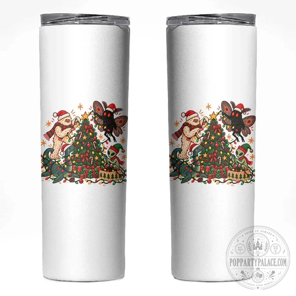 Cryptids Decorating Christmas Tree Skinny Tumbler, Bigfoot Mothman Nessie Alien Holiday